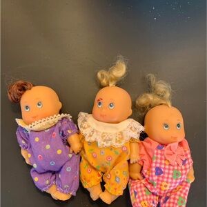 Charming Baby Doll Trio in Purple, Yellow, and Pink